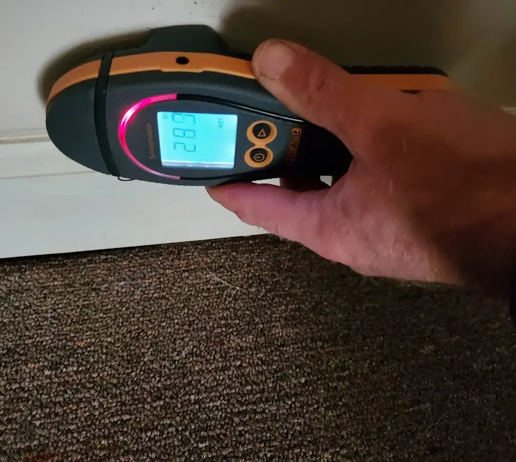 Moisture detection at baseboard during Burst Pipe Cleanup in Coral Gables